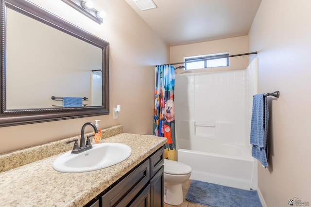 full bathroom featuring tile patterned flooring, vanity, toilet, and shower / bath combo with shower curtain