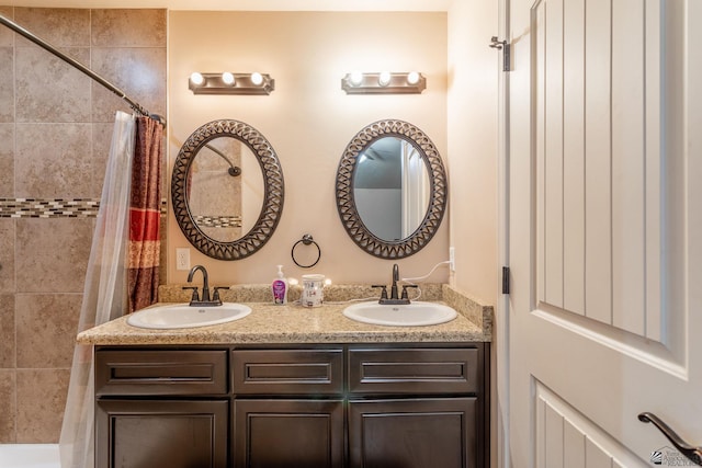 bathroom with a shower with curtain and vanity