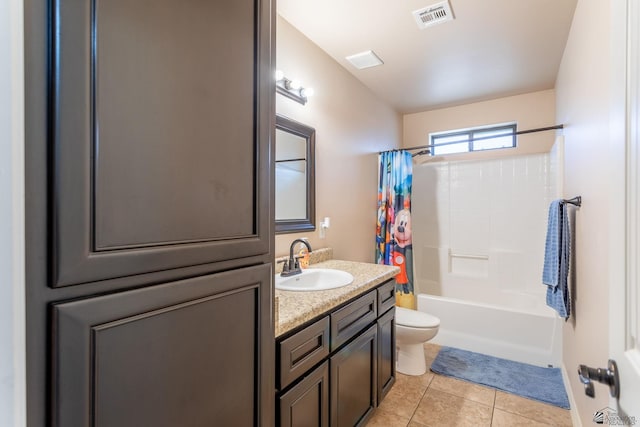 full bathroom featuring tile patterned floors, vanity, shower / bath combination with curtain, and toilet