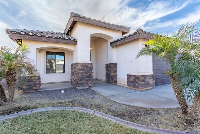 entrance to property featuring a garage