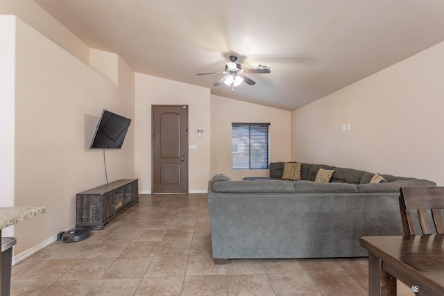 tiled living room featuring ceiling fan and lofted ceiling