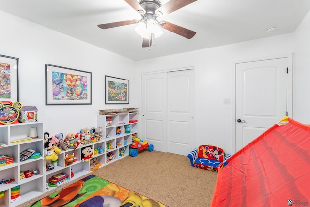 bedroom with carpet flooring, a closet, and ceiling fan