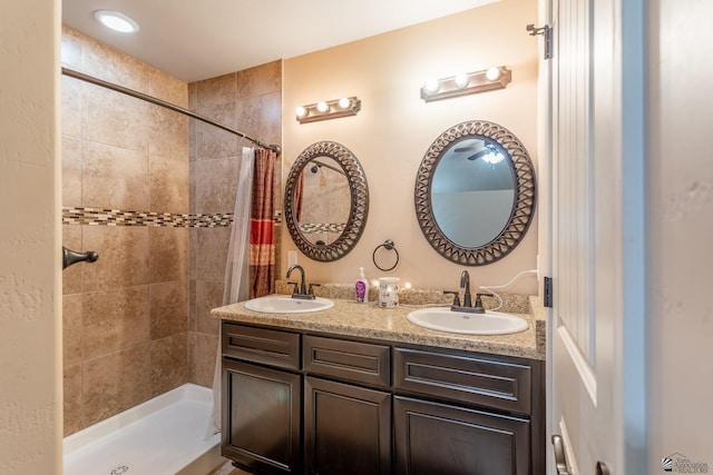 bathroom with a shower with curtain and vanity