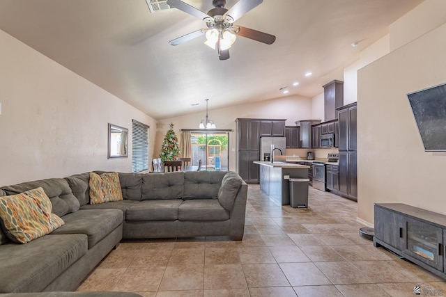 living room with sink, ceiling fan with notable chandelier, and vaulted ceiling