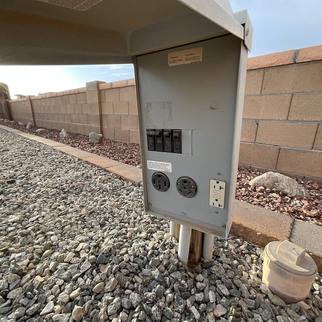 details featuring fence and mail area