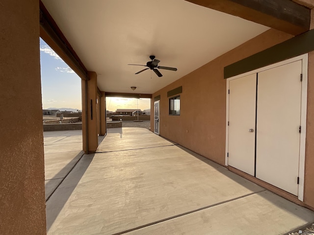 view of patio featuring ceiling fan