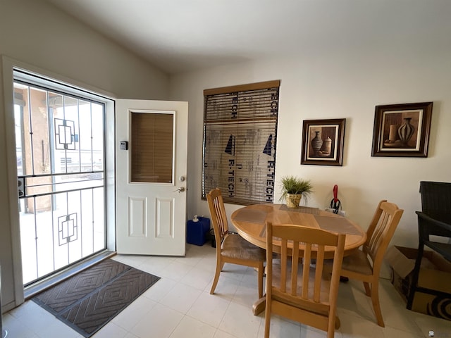 dining area with lofted ceiling
