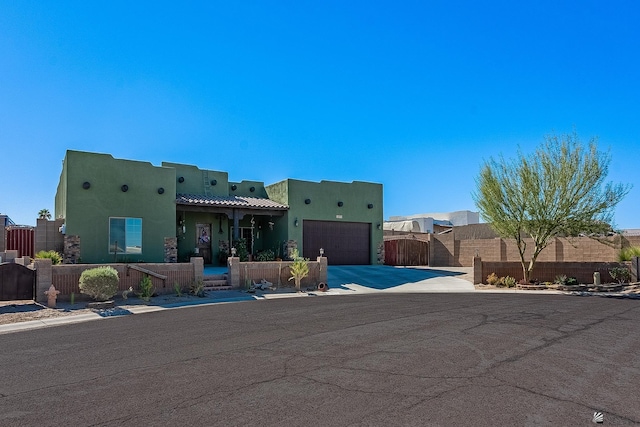 southwest-style home featuring a garage