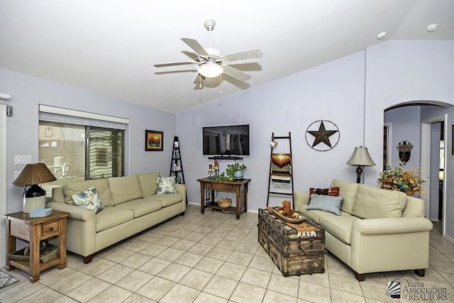 living room featuring lofted ceiling, light tile patterned floors, and ceiling fan