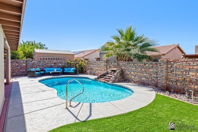 view of pool with an outdoor living space, a patio, and pool water feature