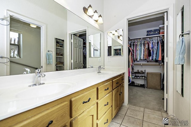 bathroom featuring tile patterned floors and vanity