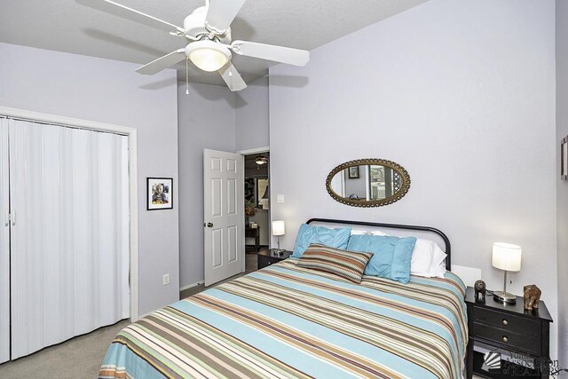 carpeted bedroom featuring ceiling fan