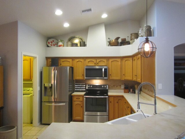 kitchen featuring light tile patterned flooring, appliances with stainless steel finishes, sink, and high vaulted ceiling