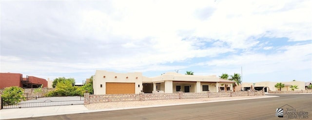 adobe home featuring a garage