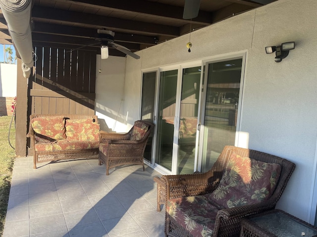 view of patio featuring ceiling fan