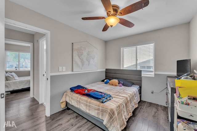 bedroom featuring ceiling fan and hardwood / wood-style floors