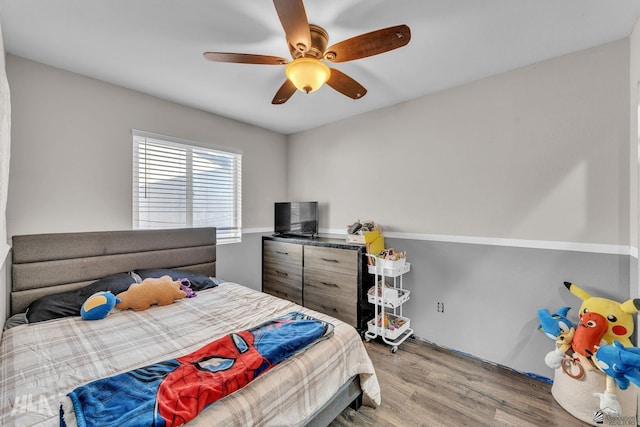 bedroom featuring ceiling fan and light hardwood / wood-style flooring