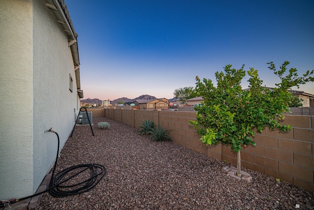 view of yard at dusk