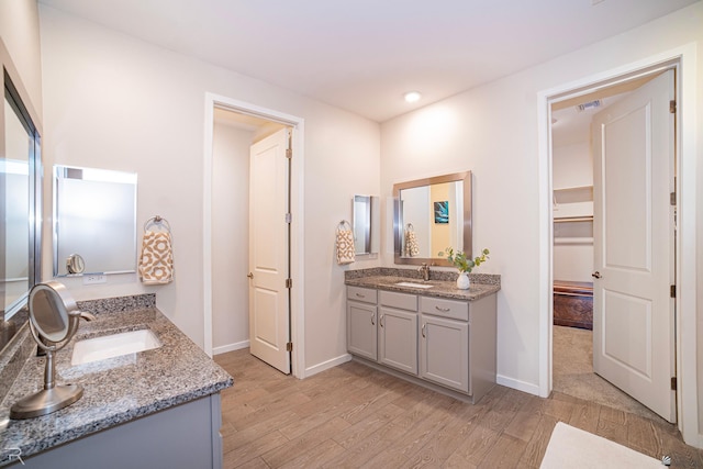 bathroom featuring vanity and hardwood / wood-style floors