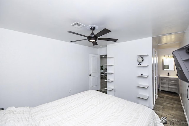 bedroom with dark wood-style floors, visible vents, and a ceiling fan