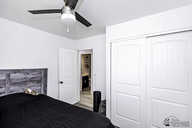 unfurnished bedroom with a ceiling fan, a closet, and light wood-style flooring