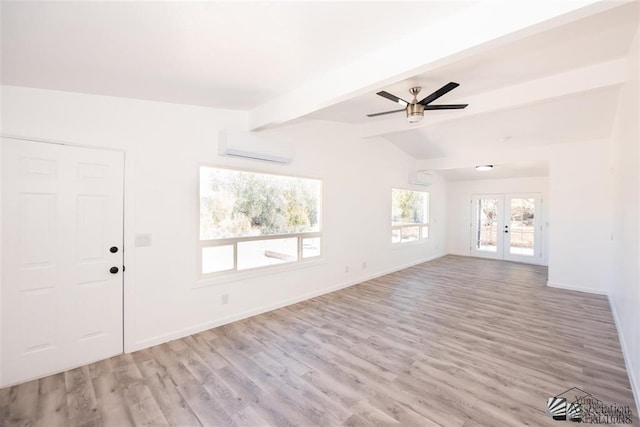 unfurnished living room with french doors, vaulted ceiling with beams, an AC wall unit, ceiling fan, and light hardwood / wood-style floors