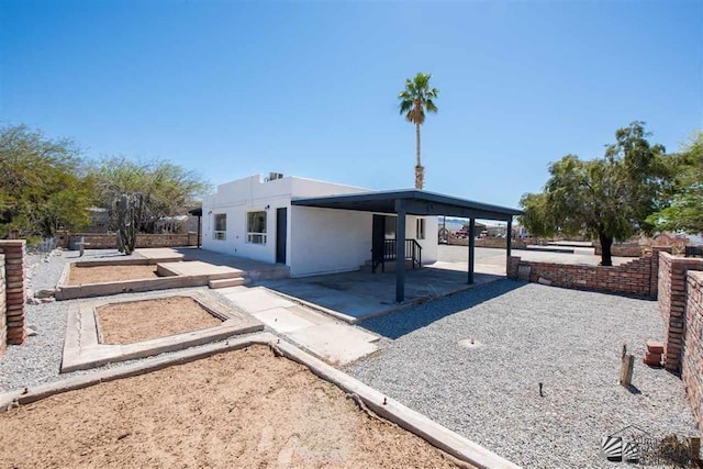 view of front facade with a patio area