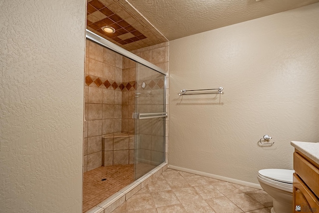 bathroom with vanity, a shower with shower door, a textured ceiling, and toilet