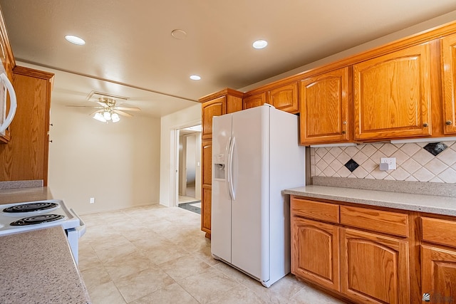 kitchen with ceiling fan, white appliances, and decorative backsplash