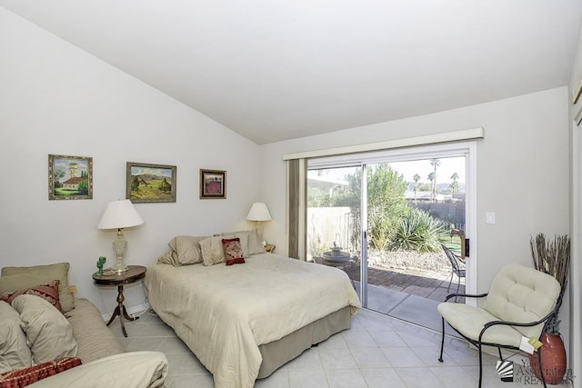 bedroom featuring access to exterior and vaulted ceiling