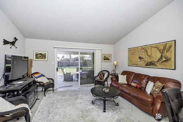 tiled living room featuring lofted ceiling