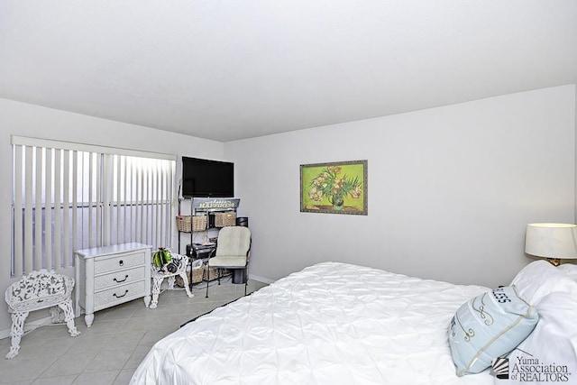 bedroom featuring light tile patterned floors