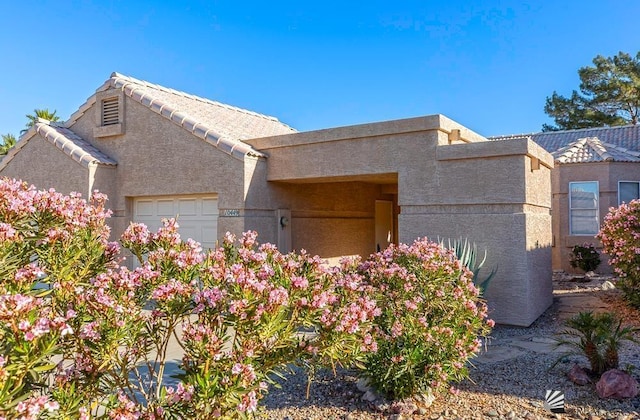 view of side of home with a garage