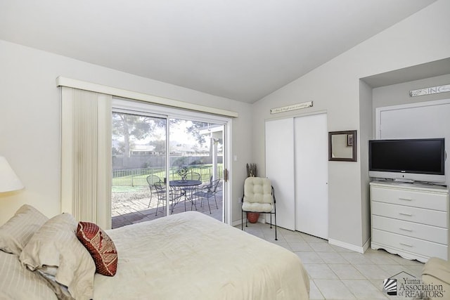 tiled bedroom with access to outside and vaulted ceiling