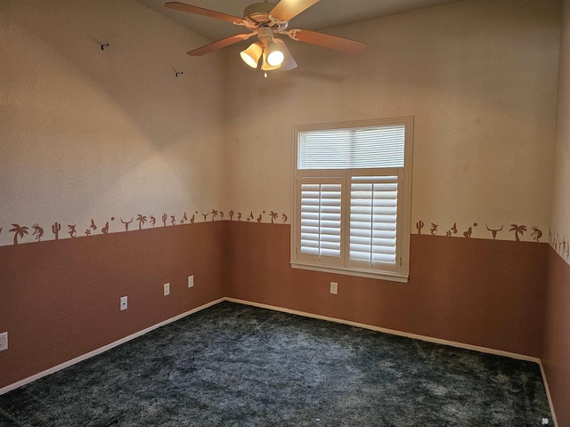 empty room featuring ceiling fan and dark carpet