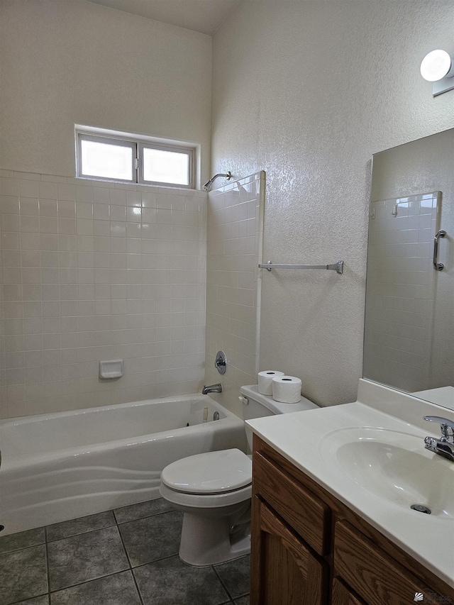 full bathroom with shower / tub combination, vanity, toilet, and tile patterned floors