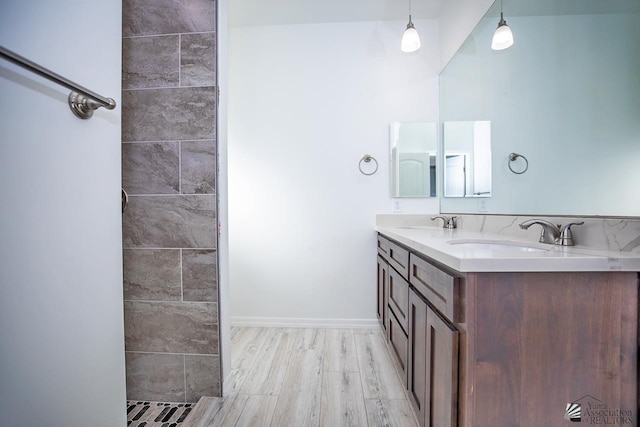 bathroom with wood-type flooring and vanity