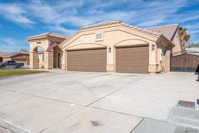 mediterranean / spanish house with a garage