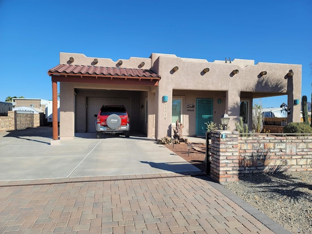 southwest-style home with a garage