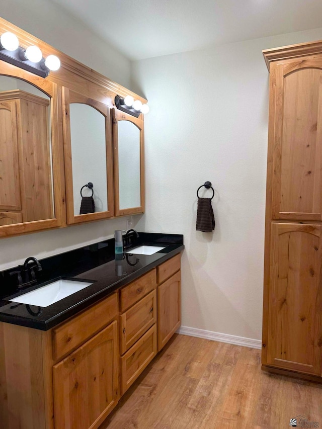 bathroom featuring vanity and hardwood / wood-style flooring