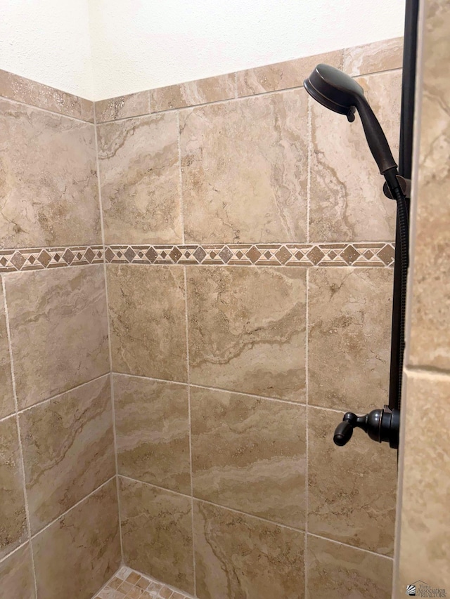 details with a tile shower