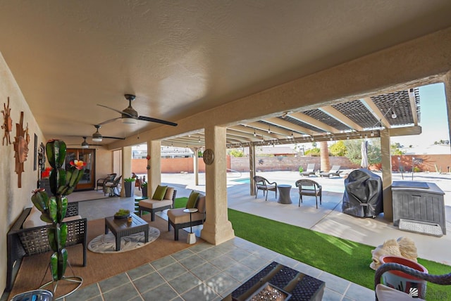 view of patio / terrace featuring a grill and an outdoor fire pit