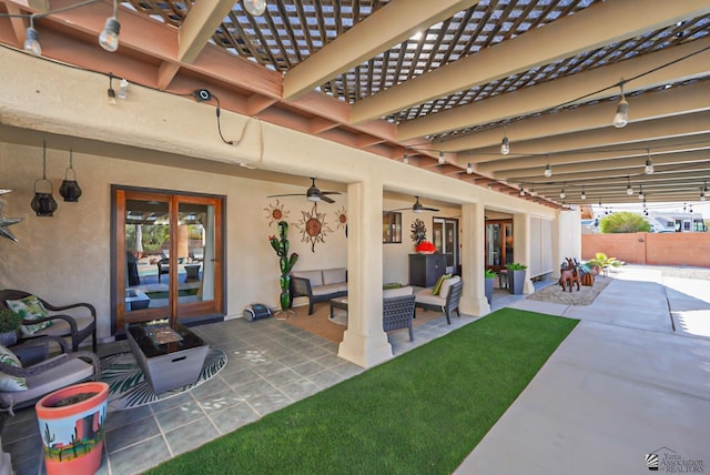 view of patio / terrace with ceiling fan and outdoor lounge area