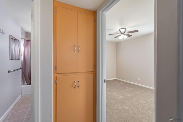 hallway with carpet floors