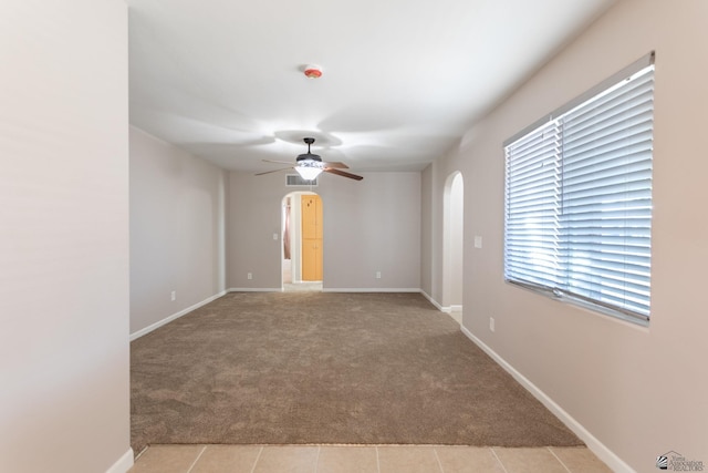 carpeted empty room with ceiling fan