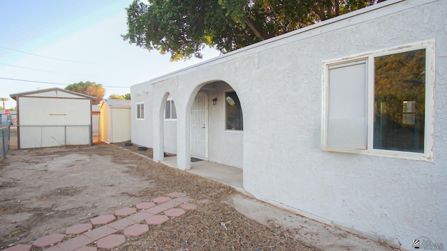 view of side of property featuring a patio