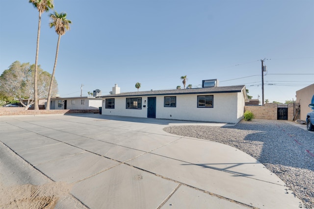 ranch-style house with stucco siding