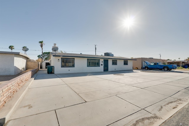 view of front of home with a patio and stucco siding