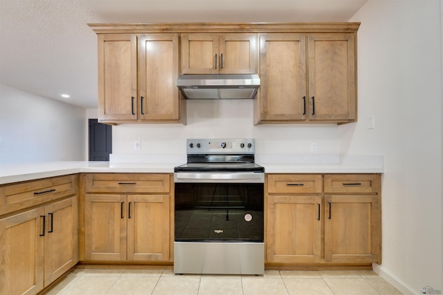 kitchen featuring light countertops, under cabinet range hood, stainless steel electric range, and light tile patterned flooring