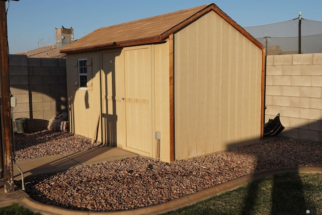 view of shed featuring a fenced backyard